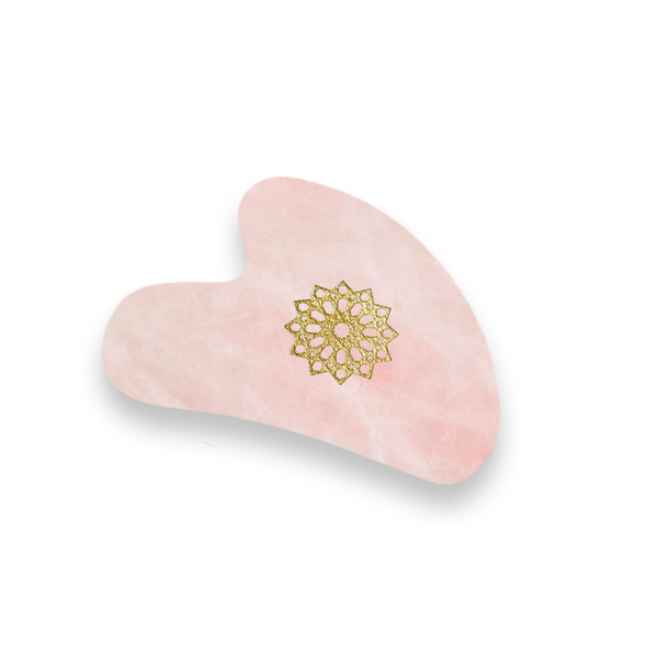 Gua Sha Quartz Rose Melchior & Balthazar, outil naturel de massage du visage, idéal pour lisser la peau et revitaliser le teint.
